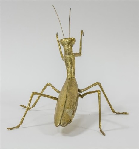 Złota figurka modliszka